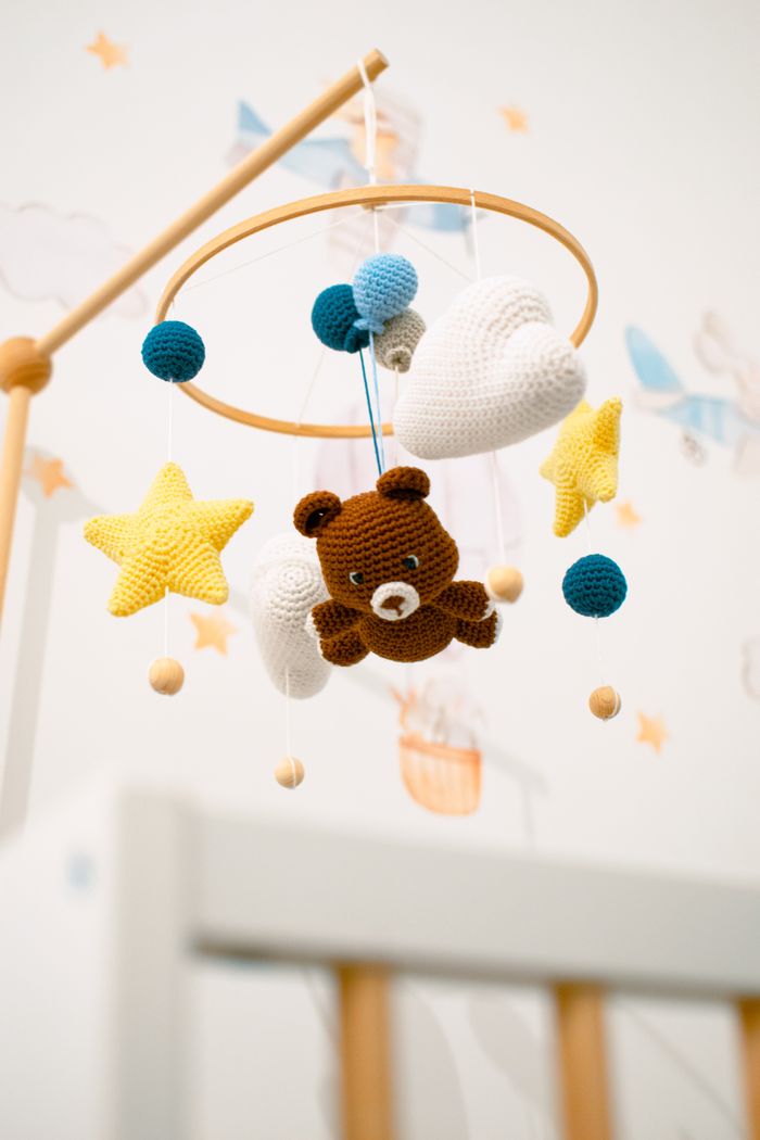 services-01 Adorable crochet teddy bear mobile with stars and clouds for baby nursery.